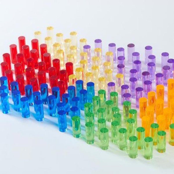 LiteZilla Mini LitePins for Mini Light Bright, colorful transparent plastic mini light pins in red, yellow, purple, blue, green, and orange arranged in rows.
