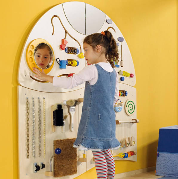 HABA Pro Sensory Learning Wall 4-Piece Set, children exploring and engaging with interactive sensory activities on a wooden wall panel with tools, mirrors, and colorful sensory objects.