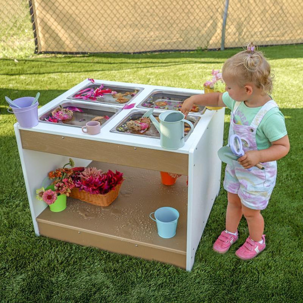 Whitney Brothers outdoorED™ Sensory Table, children engaging with water and sand activities outdoors in a grassy area.