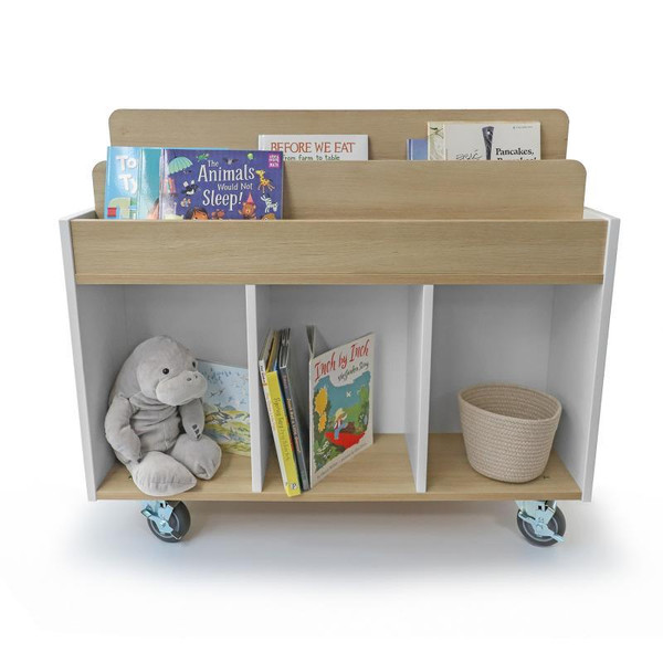 Whitney Brothers elevatED™ Mobile Book Storage Island, educational furniture with multiple compartments, books, plush toy, and storage basket on wheels.