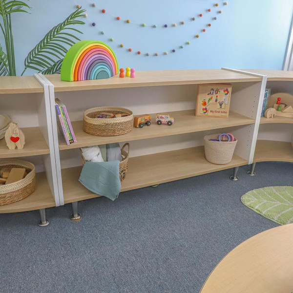 Whitney Brothers elevatED™ Adjustable Shelf Cabinet 27"H, wooden storage unit in a colorful playroom with toys and decorations.