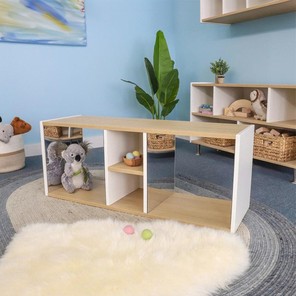 Whitney Brothers elevatED™ Discovery Crawl Thru Cabinet, children's educational furniture with open shelves and cubbies, in a playroom setting with toys and plush animals.