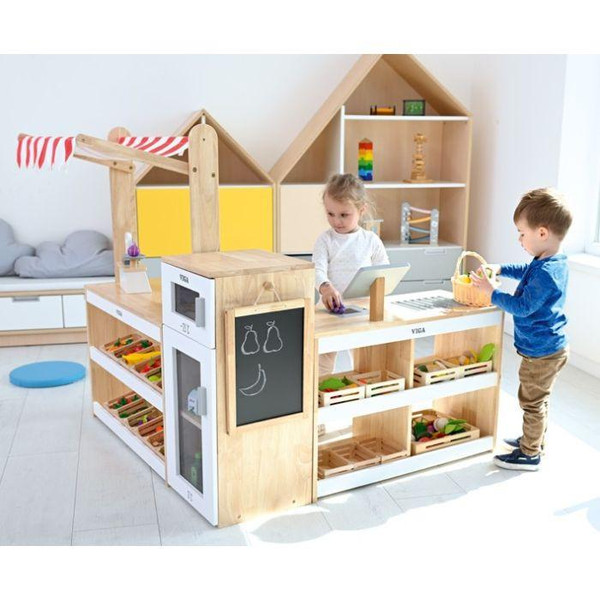 Moje Bambino Mini Market Play Store Set, children playing with a wooden toy market set in a bright playroom.