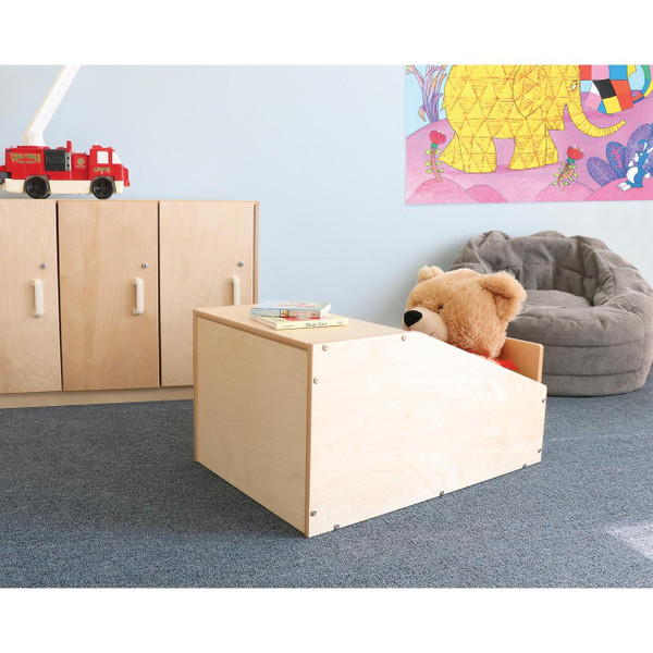 Whitney Brothers Quiet Space Cubby, a wooden cubby with a bear plush toy inside, in a child’s playroom with a gray bean bag, books, and colorful wall art.