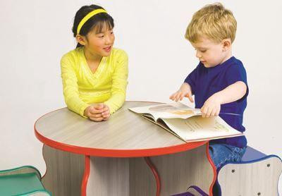 Playscapes Wavy Table and 4 Stool Set, children playing at the versatile wavy table with colorful stools in a playroom setting.