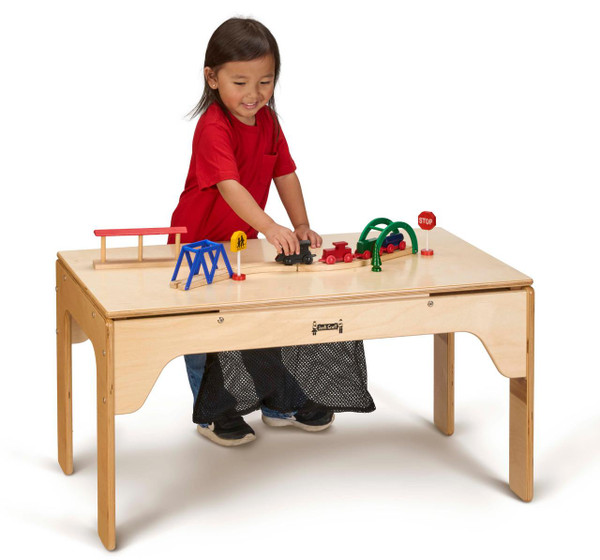 Jonti-Craft Wood DUPLO® Rectangle Storage Table 32" x 16", a young girl playing with toy train set on a wooden rectangular table with storage space, colorful train and road signs.