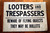 LOOTERS & TRESPASSERS Beware of Flying Objects They May Be Bullets SIGN Vintage