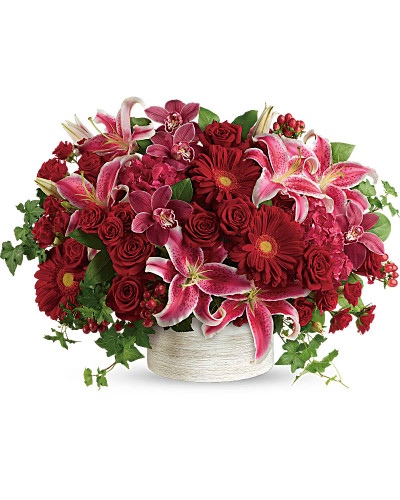 What a stunner! Leave them speechless with this boldly blooming statement of red hydrangea, orchids and roses, overflowing from a modern white cylinder.  This stunning arrangement of High End Luxury flowers is nothing short of amazing, for a statement that will never be forgotten.