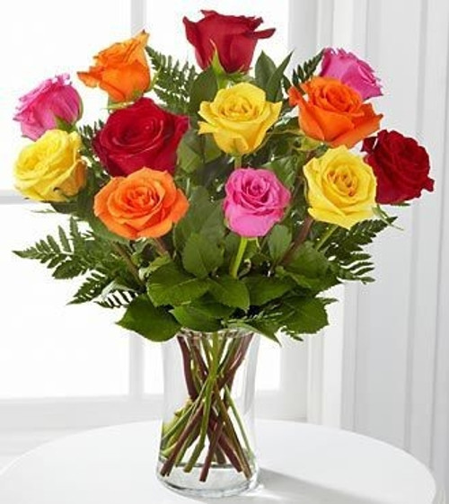 Surprise someone with a Rainbow of a Dozen Lovely Long Stem Roses!  Mixed colors compliment each other for a stunningly beautiful dozen rose bouquet.