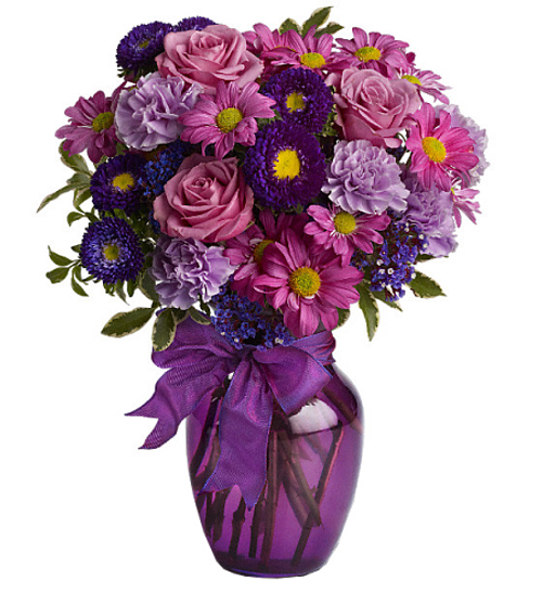 Does someone you know love the colour purple? If so, they’ll love this enchanting bouquet of fresh flowers in royal hues of lavender, lilac and violet, all dressed up with a purple satin bow! It's a charming way to display your affection at Mother's Day, Valentine's, Just Because....you name the occasion!