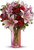 It's a statement she'll always hold close to her heart-lovely lilies and radiant roses that speak to your love and devotion. Arranged lovingly into a pink glass vase, this is a bouquet that brightens any day.