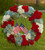 Pay tribute to a life lived in devotion and service to country with a red, white and blue floral wreath embellished with the beloved stars and stripes. A fitting way to celebrate the life of a veteran, government worker or any American patriot, this beautiful, full ring of colorful flowers includes red roses, red and white carnations and blue hydrangeas, beautifully complemented by lush greens. It adds a tasteful salute of patriotism on a floor-standing easel at a wake, for funeral services and for graveside burial services. Approximately 28"H x 24"W.