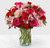 Handcrafted and inspired by the gorgeous hues of the season, the You're Precious™ Bouquet is full of sweet sentiment for your favorite person. Hot pink roses, red carnations, pink alstroemeria, and pale pink carnations come together in a clear glass vase to make any room feel beautiful and light. From special birthdays to simply just because, this arrangement is a stunning gift to give your loved ones for every occasion.