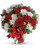 So very merry! Spread holiday cheer far and near with this festive mix of classic Christmas roses, winter forest greens and sparkling golden ornaments. 
This festive mix includes red roses, white cushion spray chrysanthemums, red carnations, white pine, douglas fir, lemon leaf, red berries and gold ornament balls. Delivered in a glass ginger vase adorned with red ribbon.