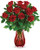 A Valentine's Day classic--with a twist! One dozen ravishing red roses look ultra luxe in this swirling glass vase with ruby red ombre finish.  This classic bouquet includes red roses and lemon leaf. Delivered in Lovely Red Ribbed Glass Vase.