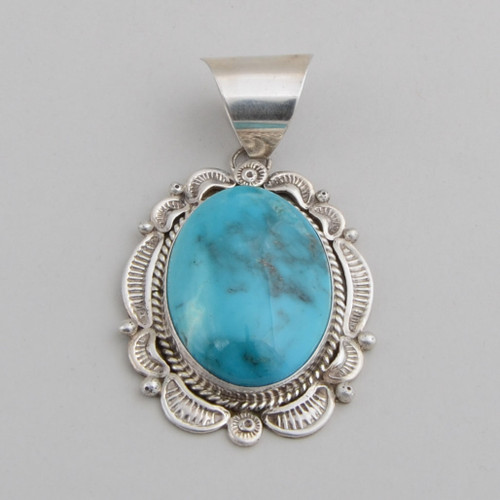Sterling Silver Pendant with Dome Cut Turquoise.