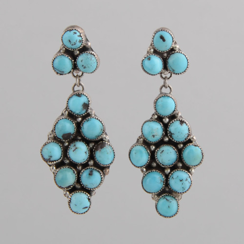 This pair of earrings features Turquoise set in Sterling Silver.