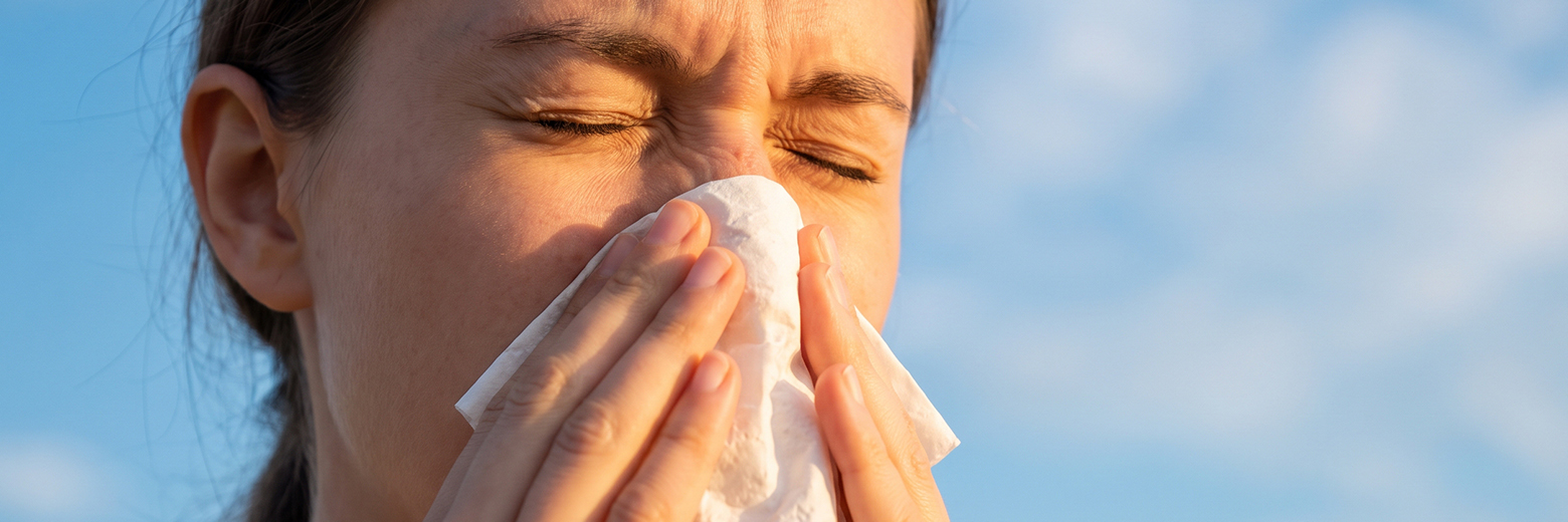 Woman sneezing