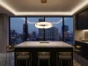 Alabaster ring LED pendant light illuminated above a dark kitchen island with floor-to-ceiling city skyline view