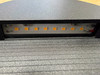 Warm white 3000K SMD LED strip inside round black outdoor step light