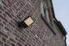 Atlantis 23.5W PIR Floodlight installed on exterior brick wall