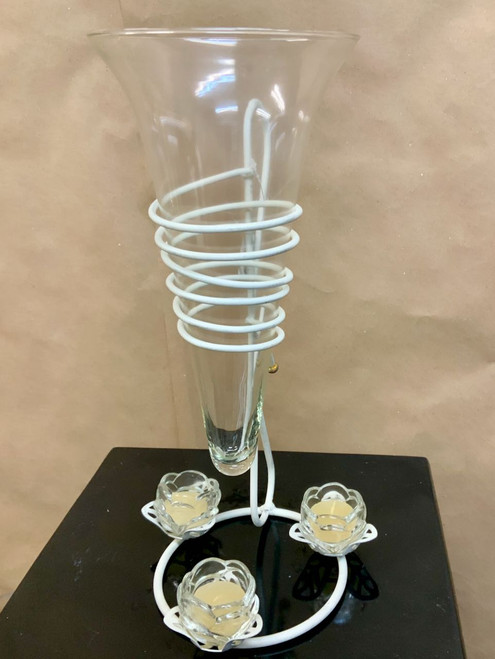Glass vase on the metal stand