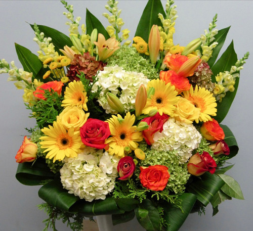 Traditional Sympathy  Arrangement With Bright  Flowers