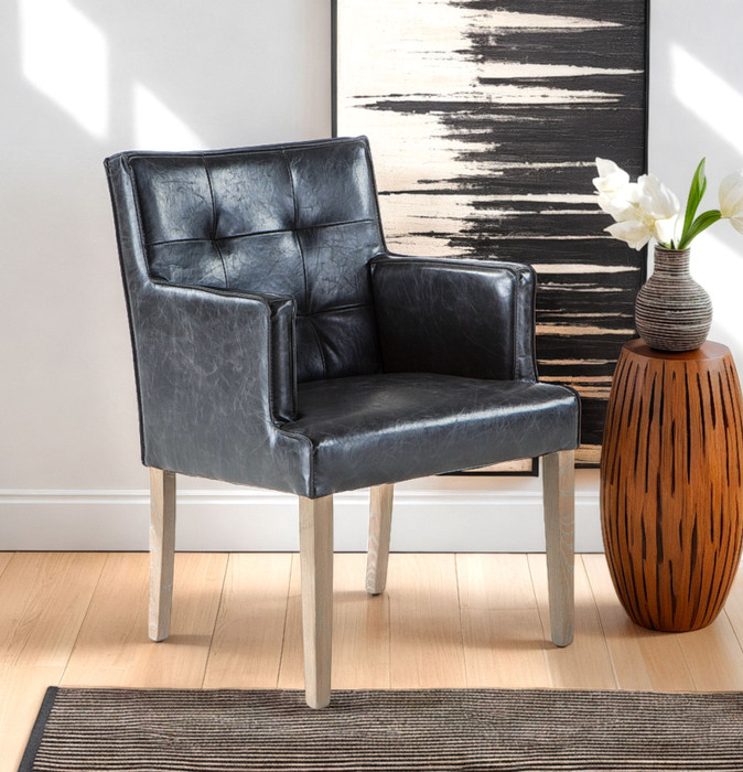 World Interiors - Aven Armchair in Black Leather with Light Legs