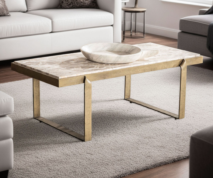World Interiors - Rhodes 49" Coffee Table with Capri Beige Marble Top and Antique Brass Base