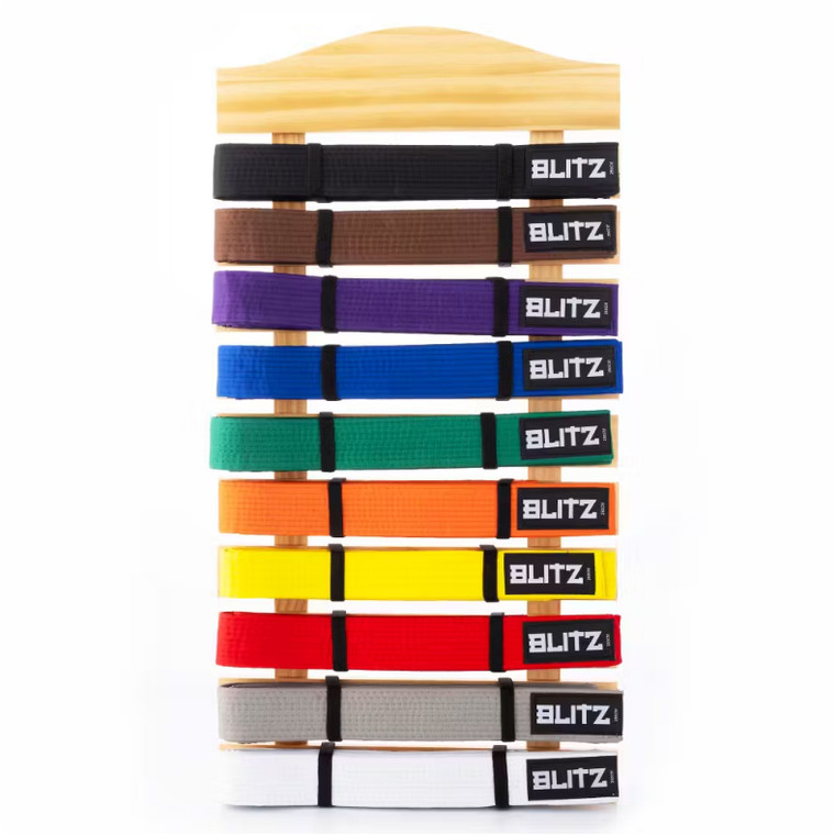 The Blitz Classic Belt Display is perfect for displaying your achievements and progression through your respective Martial Art. This customisable display can hold up to ten belts on 4.8cm slats and are easily attached with elastic straps. Made from a solid wood construction, the belt display can be hung on a wall with the two hooks on the back. Comes with 20 elastic straps. Belts sold separately. Dimensions: 68cm high x 36cm wide.