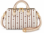 Signature pattern meets timeless structure. The Flori™ Grand Pebble features a spacious Boston silhouette finished with polished gold-tone hardware and versatile carry options.