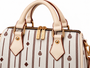 Signature pattern meets timeless structure. The Flori™ Grand Pebble features a spacious Boston silhouette finished with polished gold-tone hardware and versatile carry options.