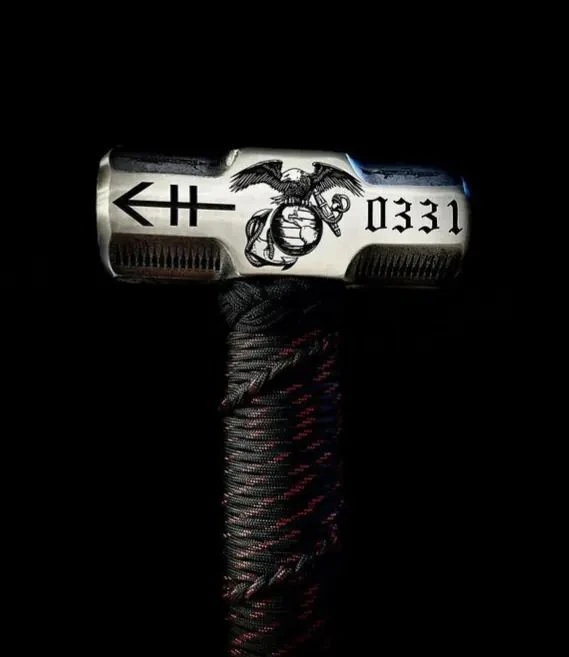 Hand-engraved legacy sledgehammer with a wrapped grip