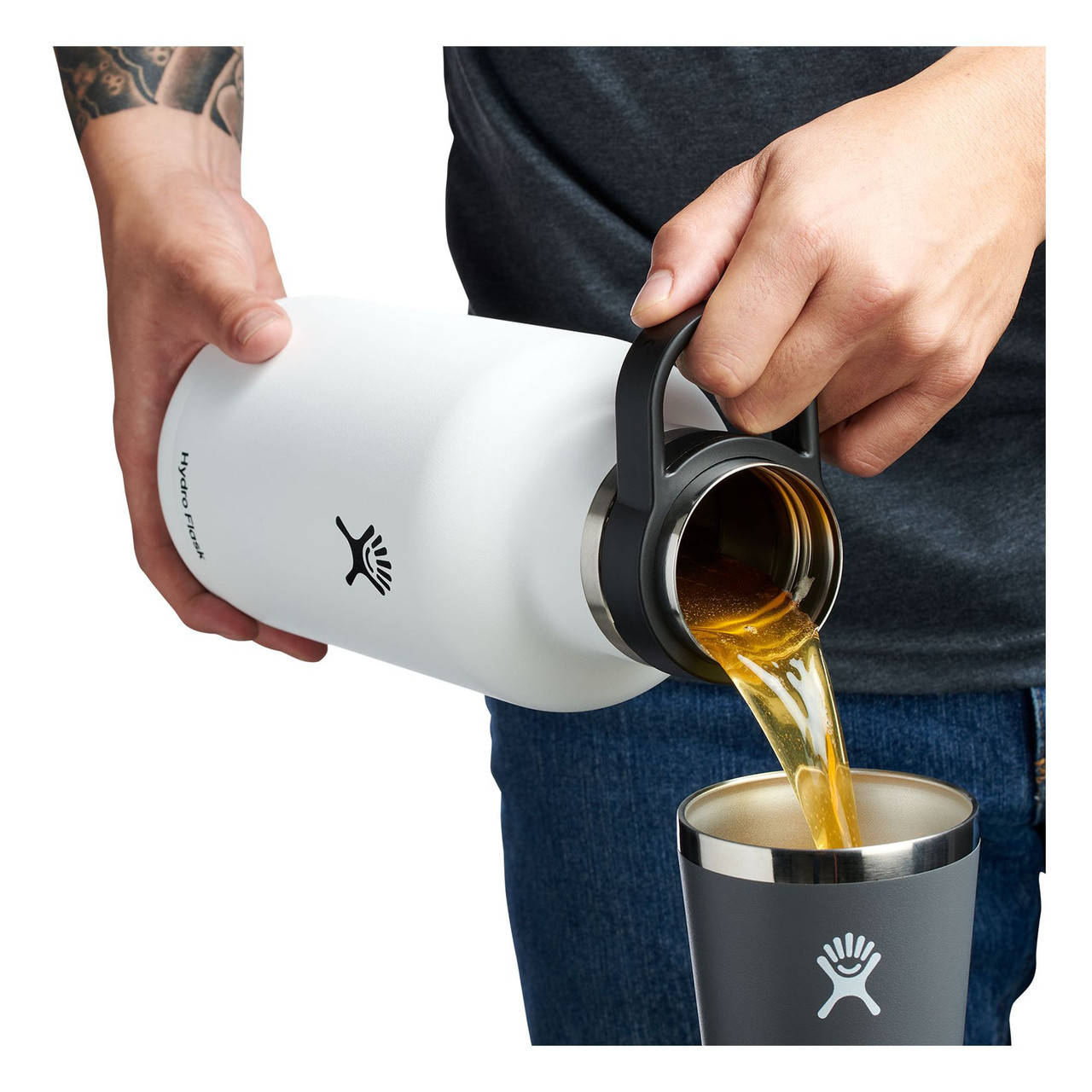https://cdn11.bigcommerce.com/s-98f3d/images/stencil/1280x1280/products/1448/30670/Hydro_Flask_Insulated_Beer_Growler_64oz_White-pouring__86373.1694649879.jpg?c=2