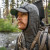 Eberlestock Pioneer Half Zip Hoody in action Gunmetal grid fleece hood up Eberlestock Pioneer Half Zip Hoody in action Gunmetal grid fleece hood up