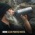Grayl Geopress 24 oz Titanium Filter & Purifier Bottle in field use drinking from it
