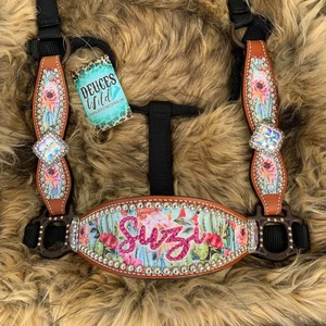 Top down angle shows accent stones on name and blinged conchos
