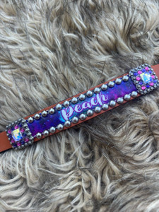 Close up of dog collar showing galaxy design and concho bling