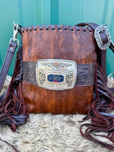 Brindle cowhide buckle bag with chocolate floral accent and chocolate leather fringe