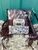 Cowhide western buckle bag with brown fringe and a crossbody strap