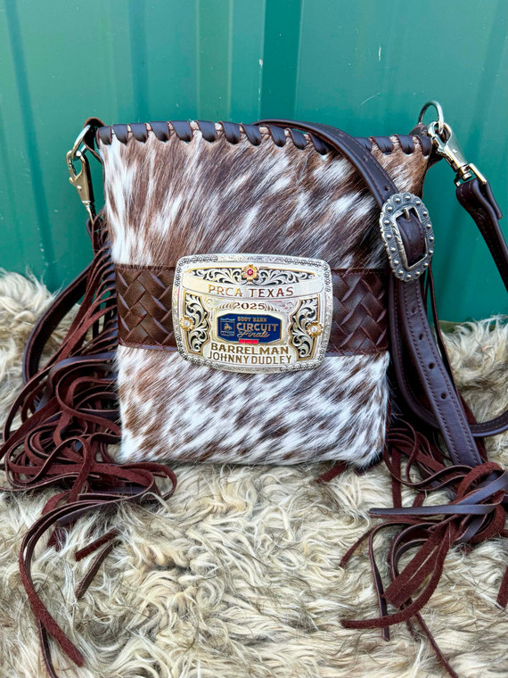 Cowhide western buckle bag with brown fringe and a crossbody strap