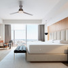 Encasement on a made hotel bed, hospitality-grade mattress protection