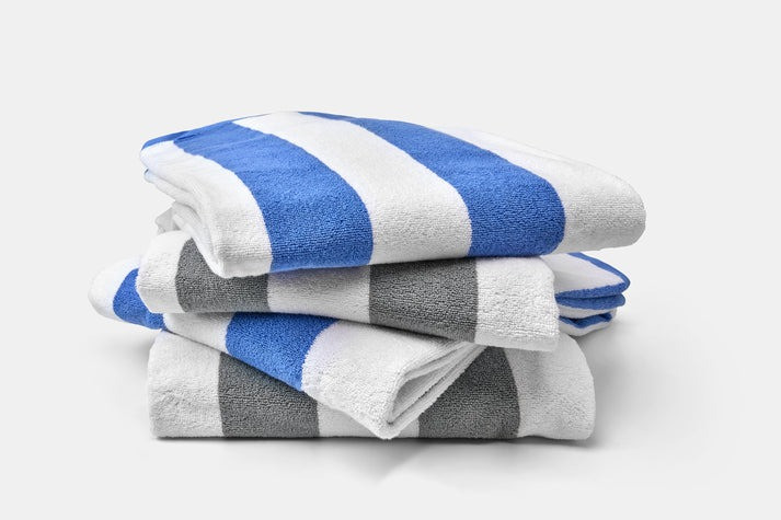 Thomaston Mills American Luxury Breeze pool towels in Ultramarine Blue / White and Ultimate Gray / White cabana stripes