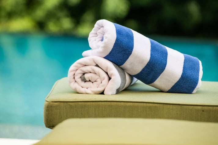 Thomaston Mills American Luxury Breeze pool towels in Ultramarine Blue / White and Ultimate Gray / White cabana stripes