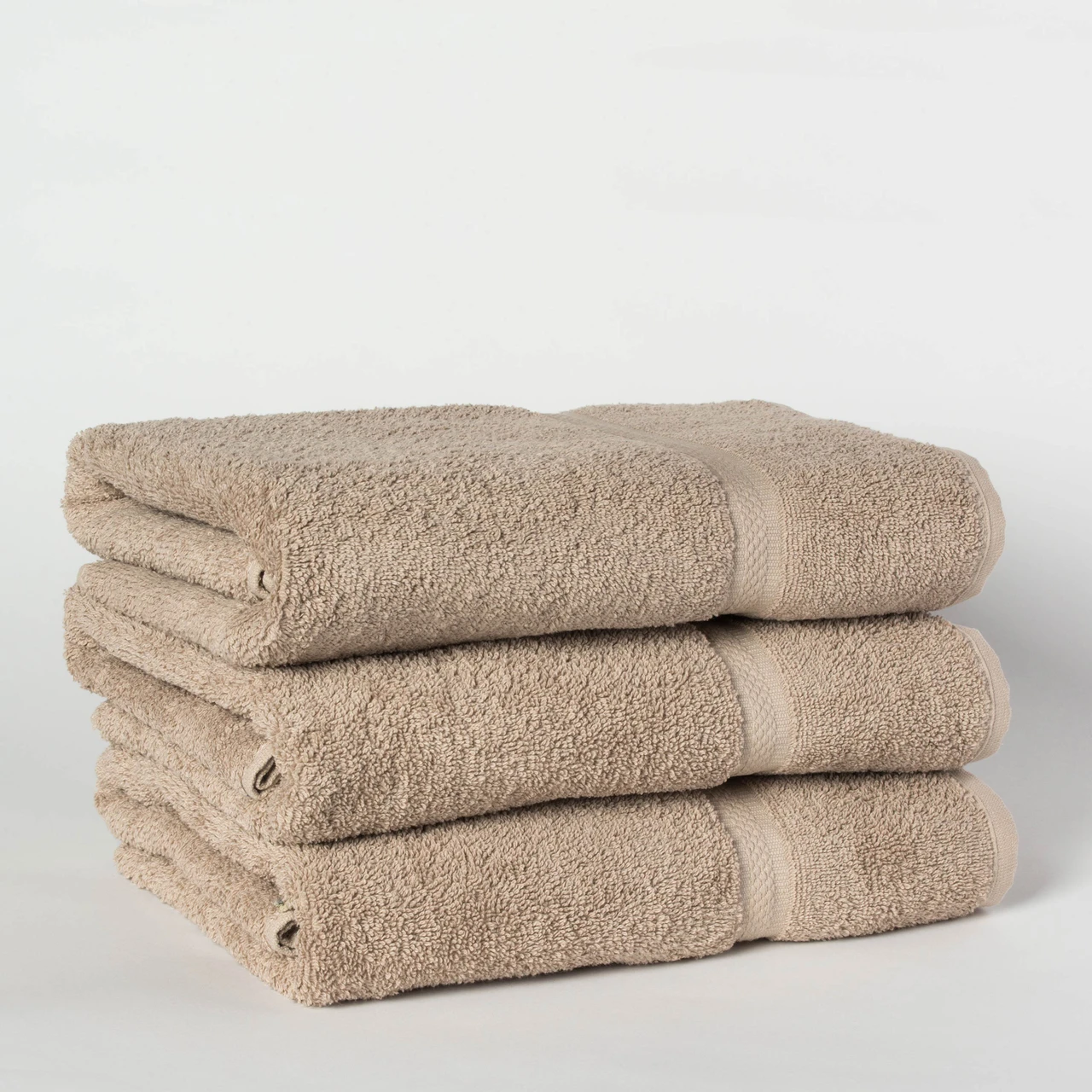 Representative Khaki Martex Colors photo shows towels, NOT the bath mat sold in this listing. Color reference only; bath-mat design may differ. See listing for size and case quantity.