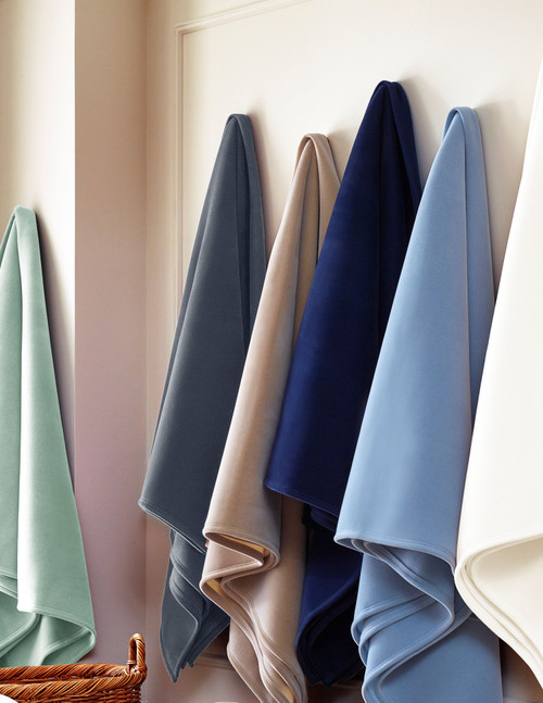 Representative Vellux collection photo shows several blanket colors, not a Pale Jade-only pack. This listing sells Pale Jade blankets only; other colors and props are excluded. See listing for size and case quantity.