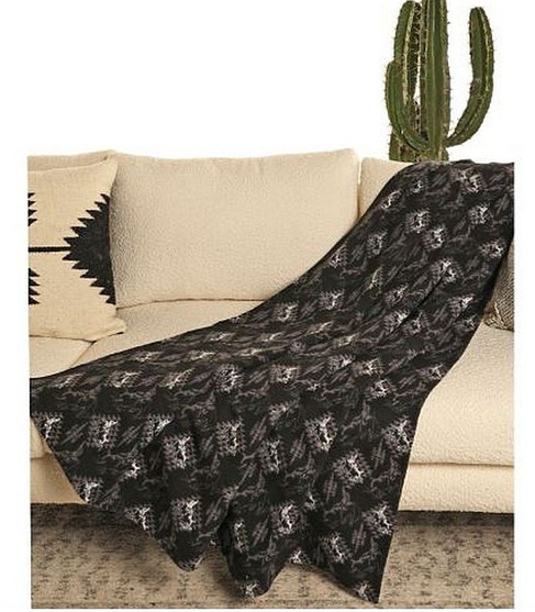 Bull Rider Aztec Jacquard Berber Blanket on couch