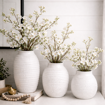 dot embossed white ceramic vase with flowers. 3 sizes
