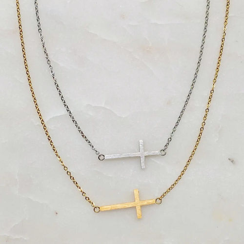 Kayla Side Cross Necklace in 18K gold-plated stainless steel featuring a delicate sideways cross on an adjustable chain.
