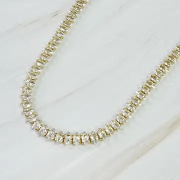 Close-up of the marquise-cut stones on the gold tennis necklace